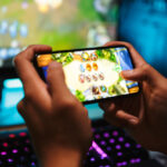 Hands,Of,Young,Gamer,Boy,Playing,Video,Games,On,Smartphone